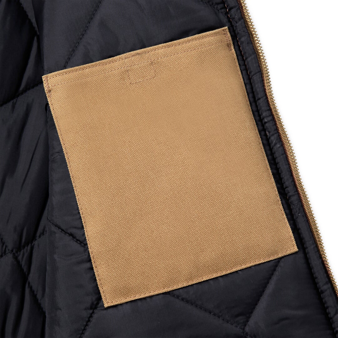 Side view of Carhartt Relaxed Fit Firm Duck Insulated Rib Collar Vest
