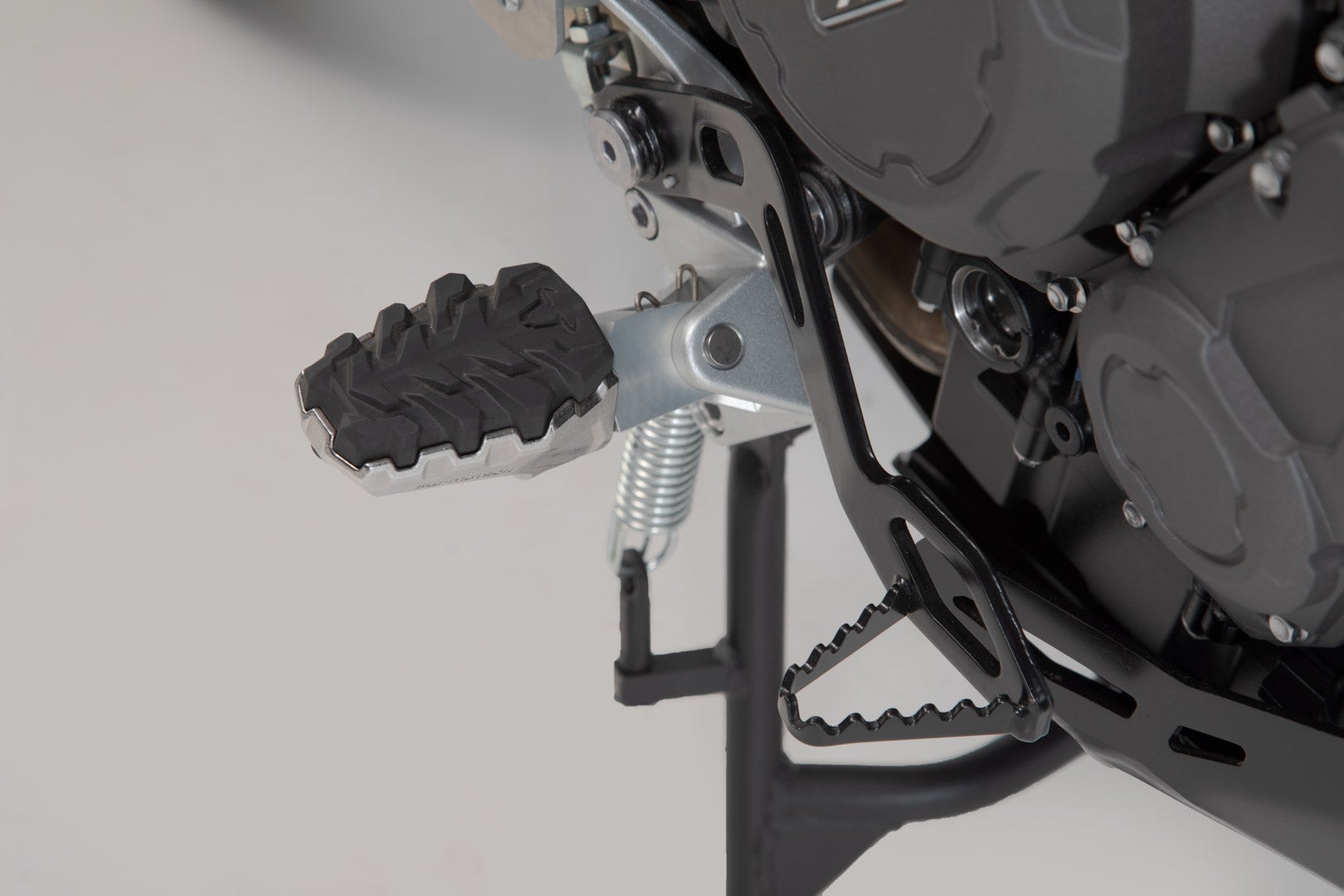 Side view of SW-Motech EVO footrest kit - Triumph Tiger 800/ 900/ 1200, Scrambler 1200.