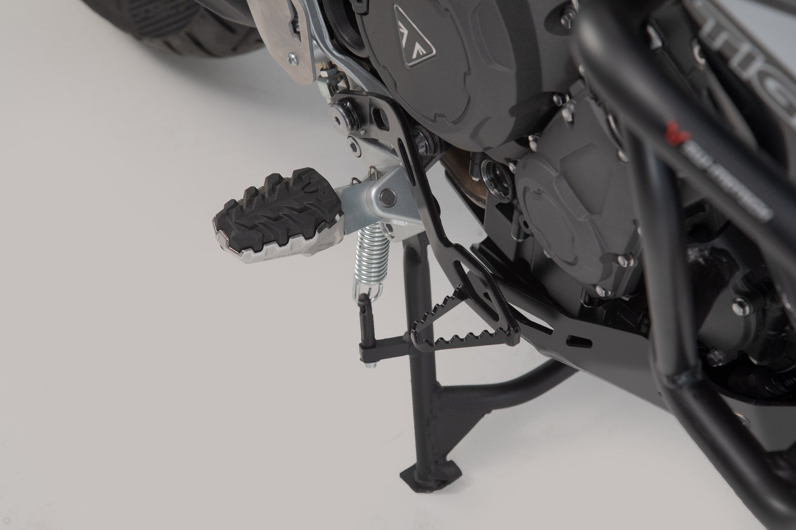 Side view of SW-Motech EVO footrest kit - Triumph Tiger 800/ 900/ 1200, Scrambler 1200.