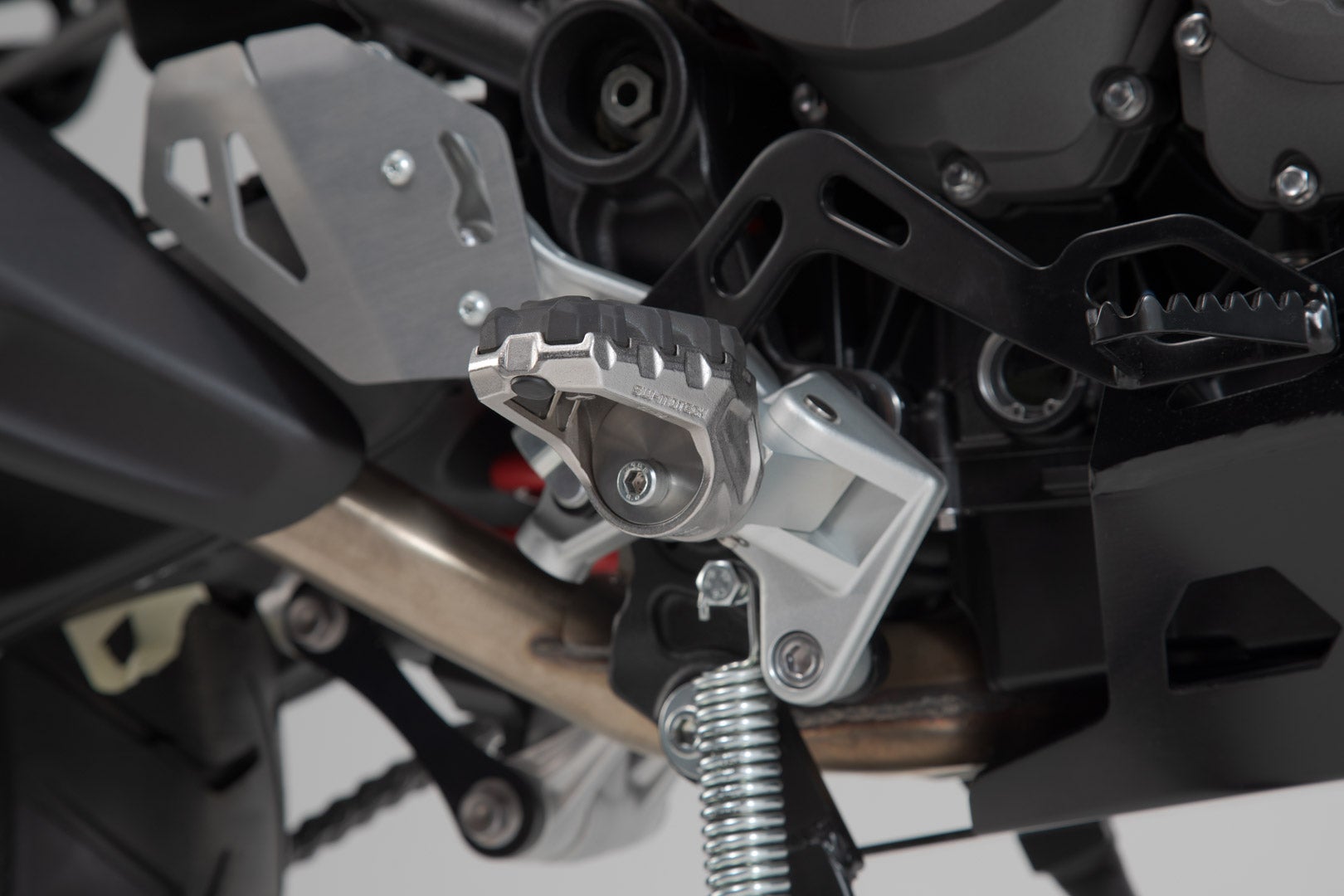 Side view of SW-Motech EVO footrest kit - Triumph Tiger 800/ 900/ 1200, Scrambler 1200.