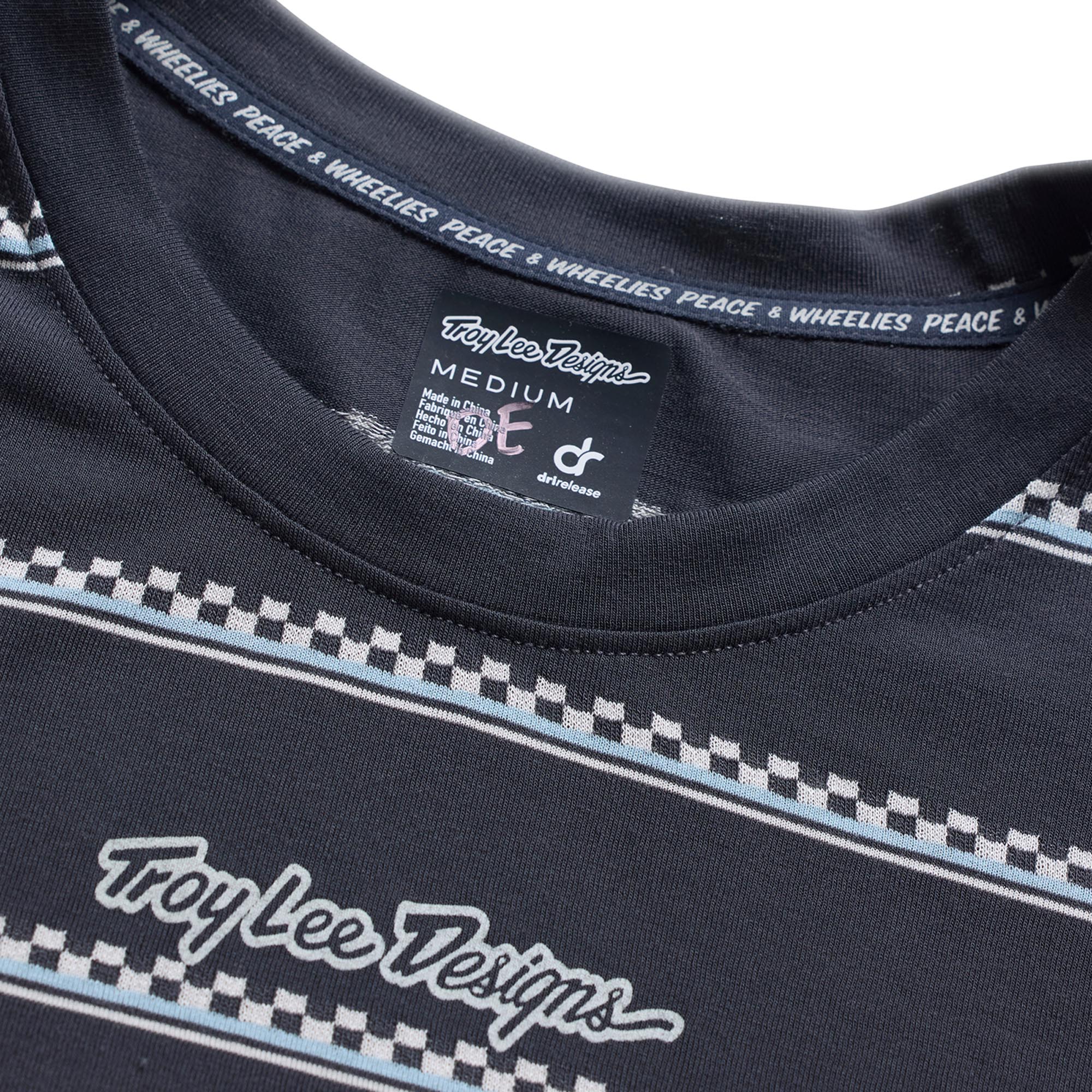 Side view of Troy Lee Designs Lilium Ride Checked Out Ladies Short Sleeve Bicycle Jersey