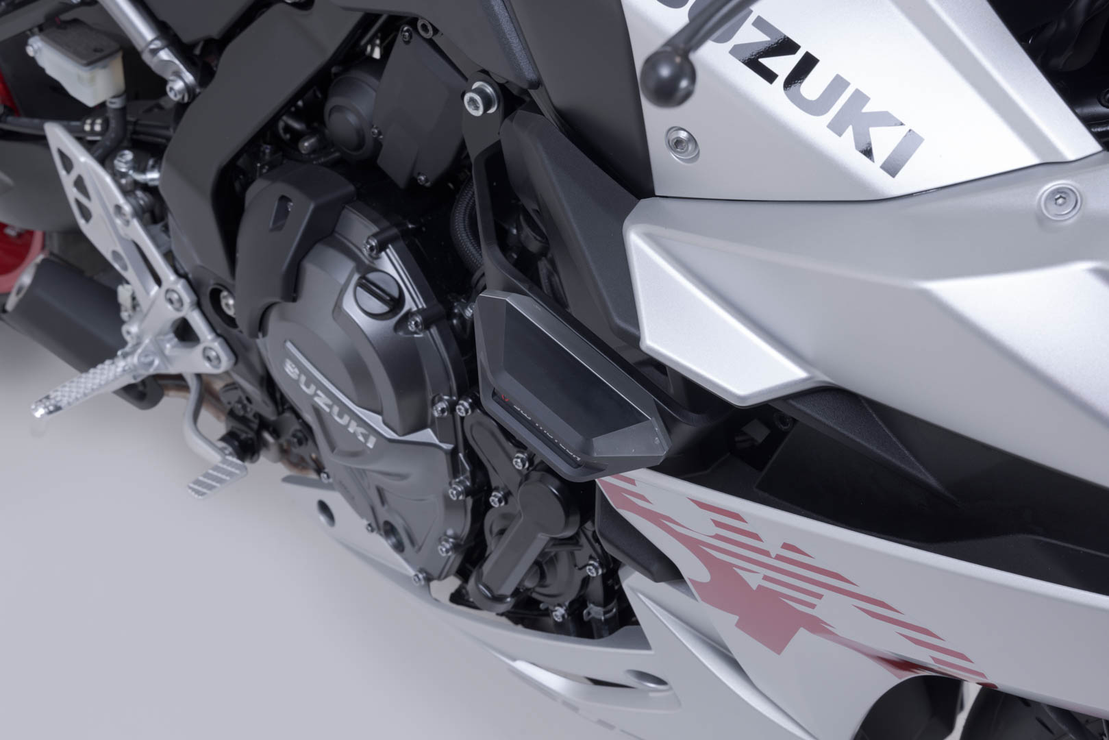 Side view of SW-Motech Frame slider kit - Black. Suzuki GSX-8R (22-25).