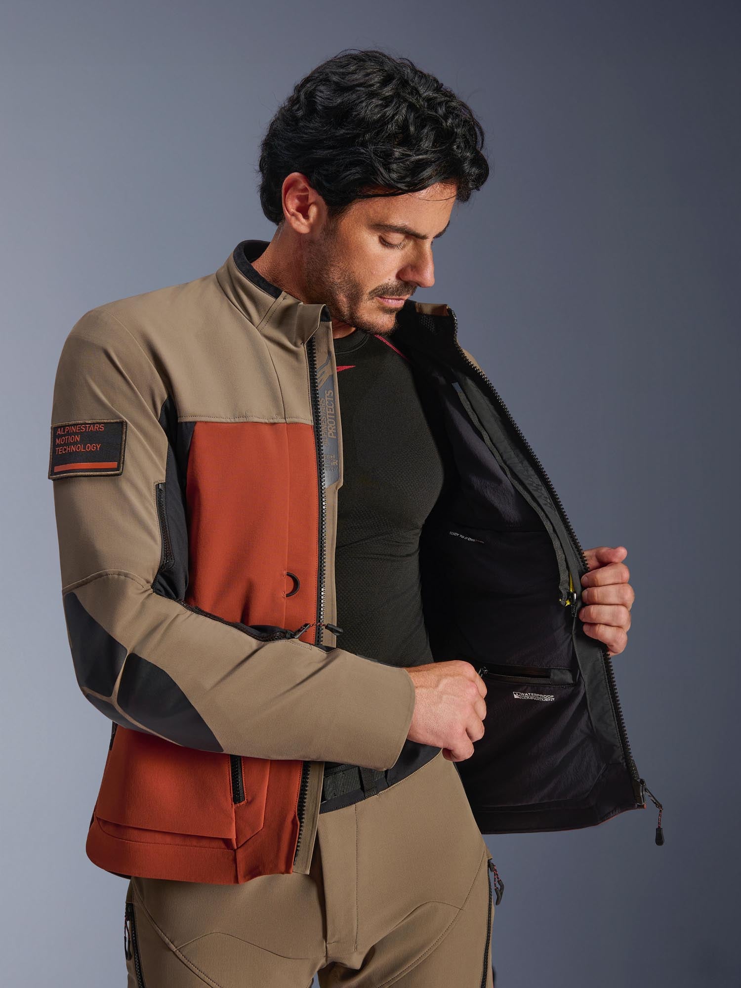 Side view of Alpinestars AMT-8 Stretch Drystar XF waterproof Motorcycle Textile Jacket