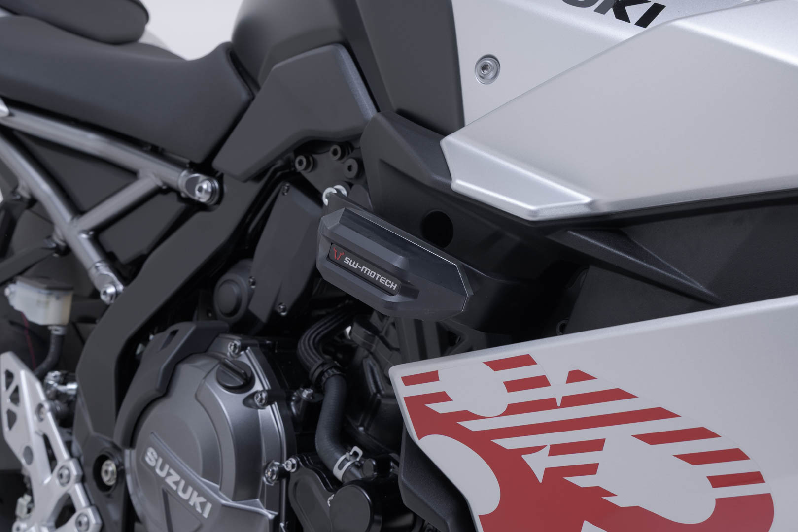 Side view of SW-Motech Frame slider kit - Black. Suzuki GSX-8R (22-25).